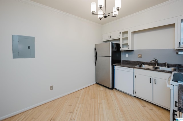 kitchen featuring white appliances, electric panel, a sink, crown molding, and a chandelier