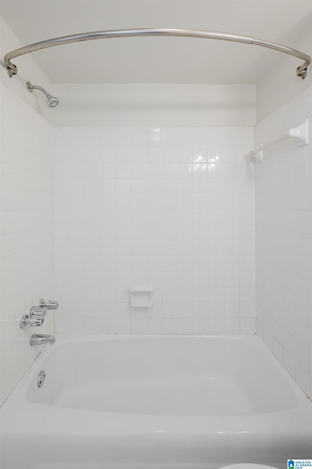 bathroom with shower / bathtub combination