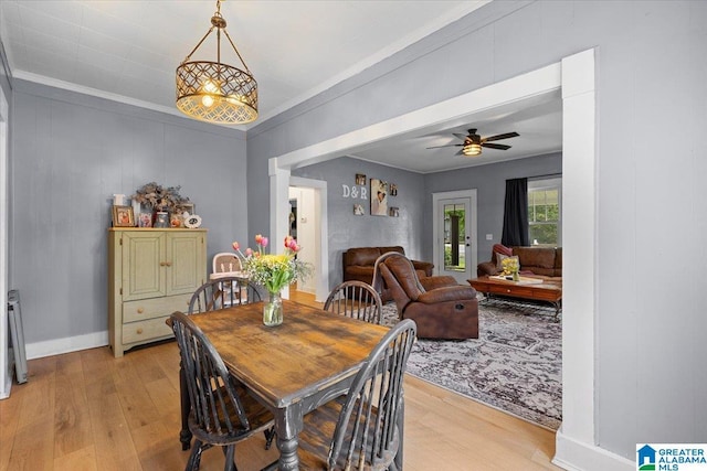 1034 Valley Rd, Oneonta, AL 35121 - dining room with light wood-style floors, ornamental molding, a ceiling fan, and baseboards