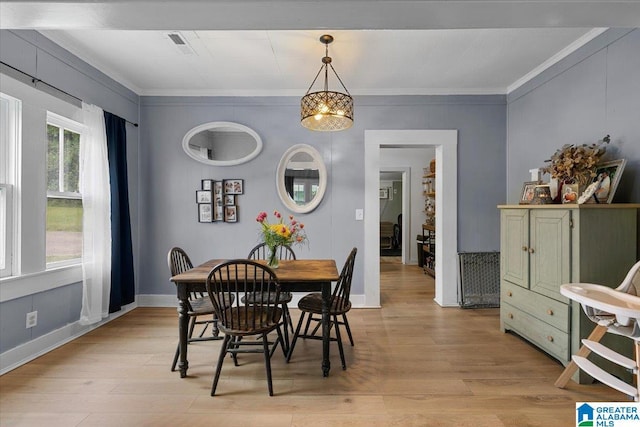 1034 Valley Rd, Oneonta, AL 35121 - dining room featuring light wood finished floors, crown molding, and baseboards