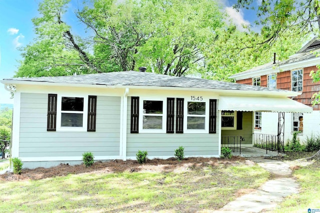 1545 32nd St, Birmingham, AL 35218 - view of front facade with a porch and roof with shingles