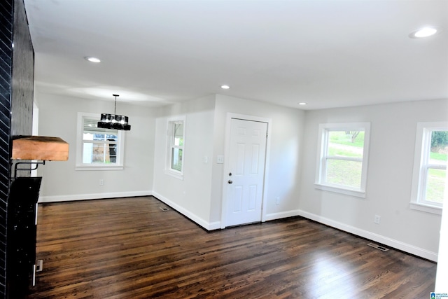 1545 32nd St, Birmingham, AL 35218 - foyer featuring dark wood-type flooring, a chandelier, baseboards, and recessed lighting