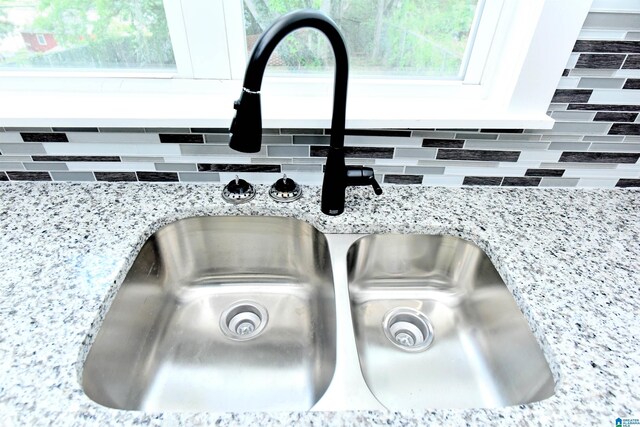 1545 32nd St, Birmingham, AL 35218 - kitchen view of a sink and light stone counters
