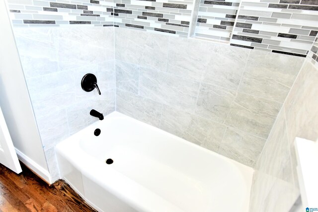1545 32nd St, Birmingham, AL 35218 - full bath featuring wood finished floors and bathtub / shower combination