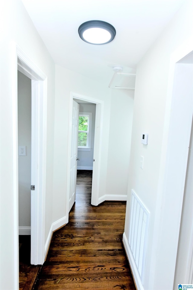1545 32nd St, Birmingham, AL 35218 - hall featuring dark wood-style flooring and baseboards