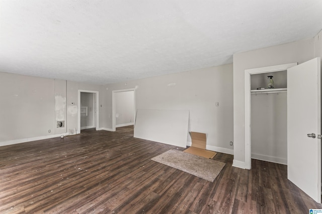 below grade area featuring wood finished floors and baseboards