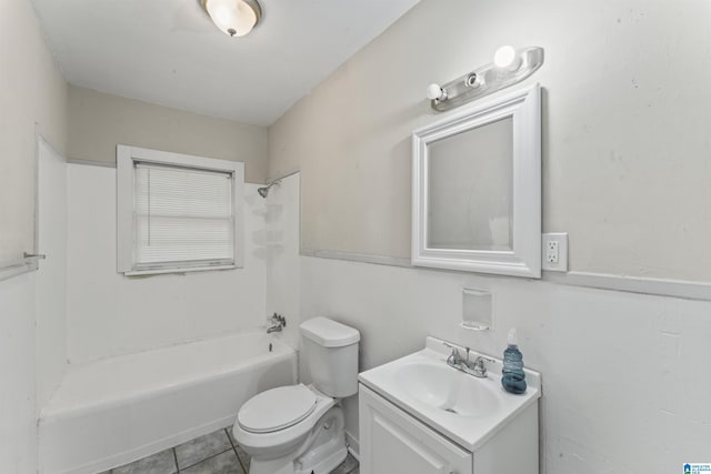 full bathroom featuring toilet, vanity, tile patterned floors, and shower / washtub combination