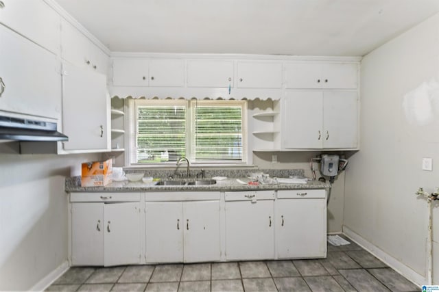 kitchen with open shelves, a sink, and white cabinetry