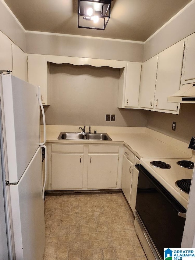kitchen with electric range oven, freestanding refrigerator, a sink, under cabinet range hood, and white cabinets