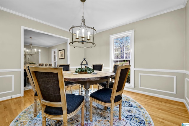 2673 Buckboard Rd, Birmingham, AL 35244 - dining space with a chandelier, light wood-style flooring, ornamental molding, and wainscoting