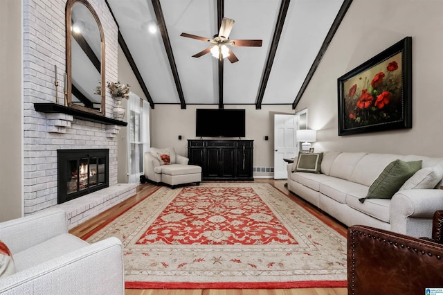 2673 Buckboard Rd, Birmingham, AL 35244 - living area with a ceiling fan, wood finished floors, beam ceiling, a fireplace, and baseboards