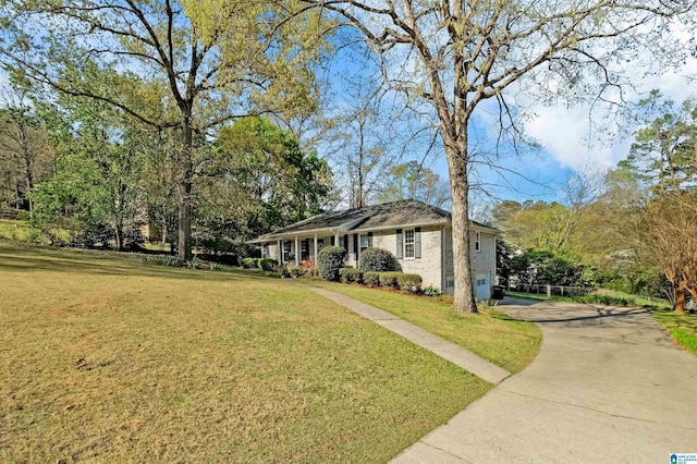2673 Buckboard Rd, Birmingham, AL 35244 - ranch-style house featuring driveway, a front lawn, a garage, and brick siding
