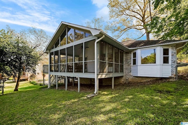 2673 Buckboard Rd, Birmingham, AL 35244 - rear view of house featuring a sunroom, a yard, and stairway