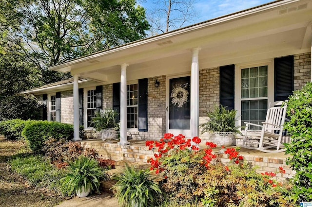 2673 Buckboard Rd, Birmingham, AL 35244 - property entrance with a porch and brick siding