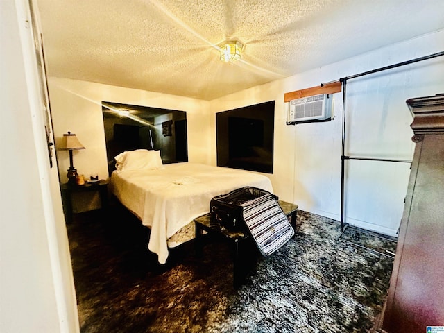 1 Annie Humber Rd, Adger, AL 35006 - bedroom featuring a textured ceiling, a wall mounted AC, finished concrete floors, and a ceiling fan