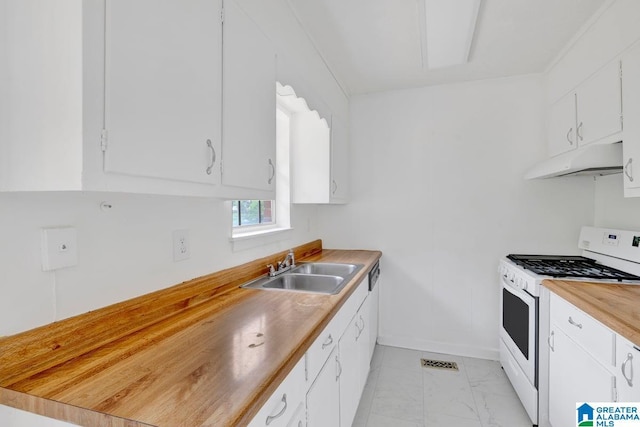 kitchen with white gas range oven, under cabinet range hood, a sink, butcher block counters, and white cabinetry