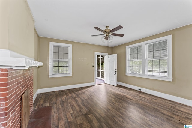 315 W Parkway Ave, Talladega, AL 35160 - unfurnished living room with baseboards, wood finished floors, ceiling fan, and a fireplace