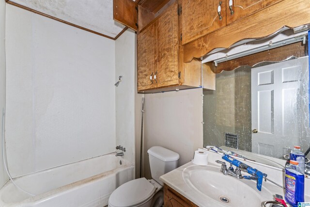315 W Parkway Ave, Talladega, AL 35160 - bathroom with toilet, vanity, crown molding, and tub / shower combination