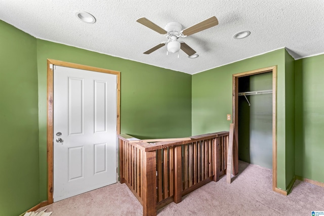 315 W Parkway Ave, Talladega, AL 35160 - corridor featuring carpet floors, a textured ceiling, and baseboards
