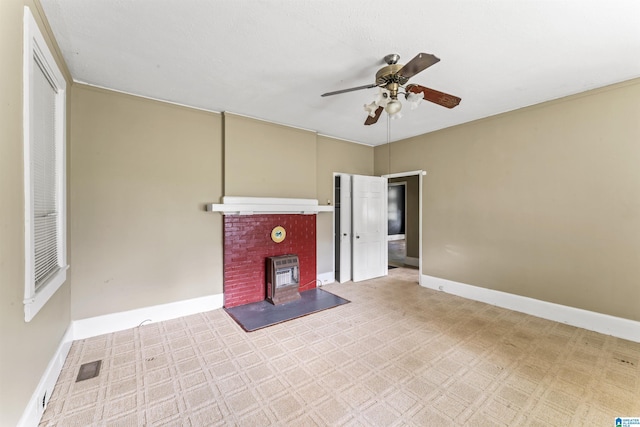 315 W Parkway Ave, Talladega, AL 35160 - unfurnished living room with ceiling fan, carpet flooring, and baseboards