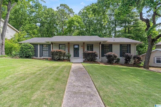 1112 Del Ray Dr, Birmingham, AL 35213 - single story home featuring brick siding, a front lawn, roof with shingles, and a porch