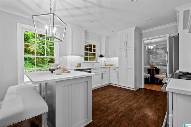 2208 Garland Dr, Vestavia Hills, AL 35216 - kitchen featuring white cabinets, backsplash, light countertops, ornamental molding, and recessed lighting