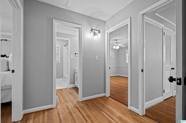 2208 Garland Dr, Vestavia Hills, AL 35216 - hall featuring light wood-type flooring, baseboards, and crown molding