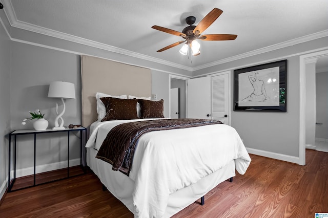 2208 Garland Dr, Vestavia Hills, AL 35216 - bedroom featuring baseboards, wood finished floors, ornamental molding, a closet, and ceiling fan