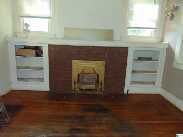 1608 N 19th St, Birmingham, AL 35234 - unfurnished living room with hardwood / wood-style floors, built in shelves, and healthy amount of natural light
