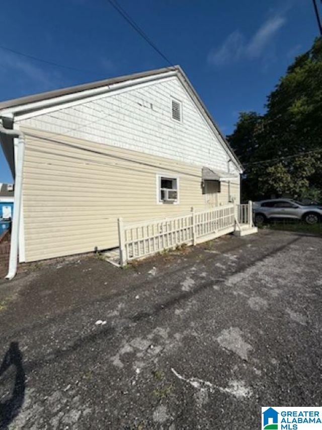 view of property exterior featuring fence