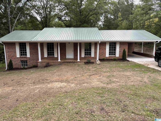 5457 Snowville Brent Rd, Dora, AL 35062 - ranch-style home with covered porch, an attached carport, driveway, a front lawn, and brick siding