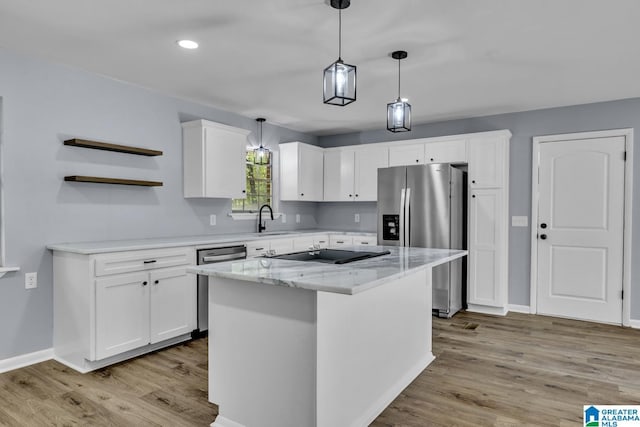 5457 Snowville Brent Rd, Dora, AL 35062 - kitchen with appliances with stainless steel finishes, wood finished floors, a sink, white cabinetry, and recessed lighting