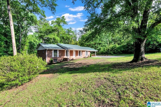 5457 Snowville Brent Rd, Dora, AL 35062 - ranch-style home featuring brick siding, a front lawn, and metal roof