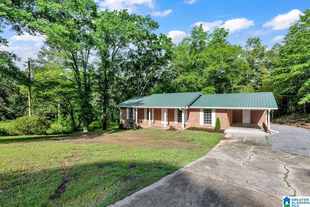 5457 Snowville Brent Rd, Dora, AL 35062 - ranch-style home with concrete driveway, an attached carport, a front lawn, metal roof, and brick siding