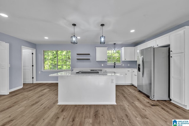 5457 Snowville Brent Rd, Dora, AL 35062 - kitchen with stainless steel refrigerator with ice dispenser, healthy amount of natural light, a kitchen island, light wood-style flooring, and recessed lighting