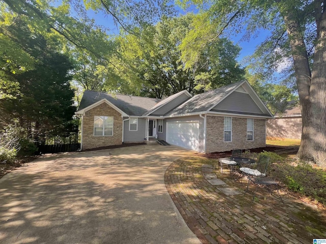 1834 Brandon Way, Bessemer, AL 35022 - ranch-style home with a garage, concrete driveway, brick siding, and stone siding