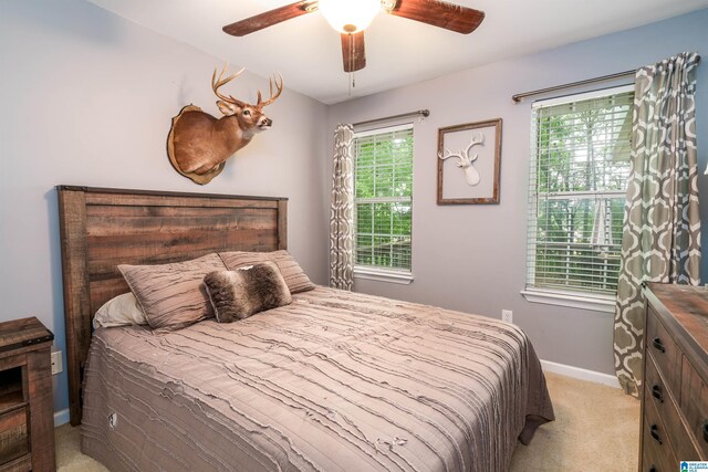 1834 Brandon Way, Bessemer, AL 35022 - bedroom featuring light carpet, baseboards, and a ceiling fan
