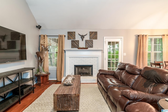 1834 Brandon Way, Bessemer, AL 35022 - living area with lofted ceiling, wood finished floors, and a fireplace