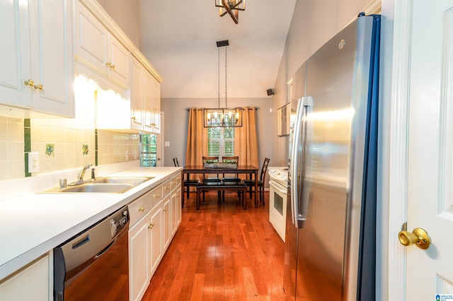 1834 Brandon Way, Bessemer, AL 35022 - kitchen with freestanding refrigerator, dishwashing machine, a chandelier, a sink, and light countertops