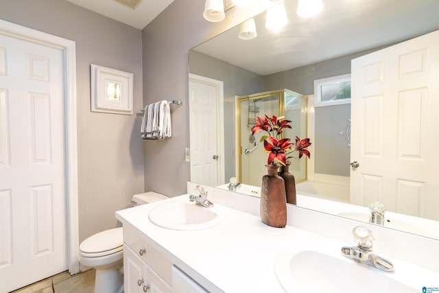 1834 Brandon Way, Bessemer, AL 35022 - full bath featuring a stall shower, toilet, double vanity, and tile patterned flooring
