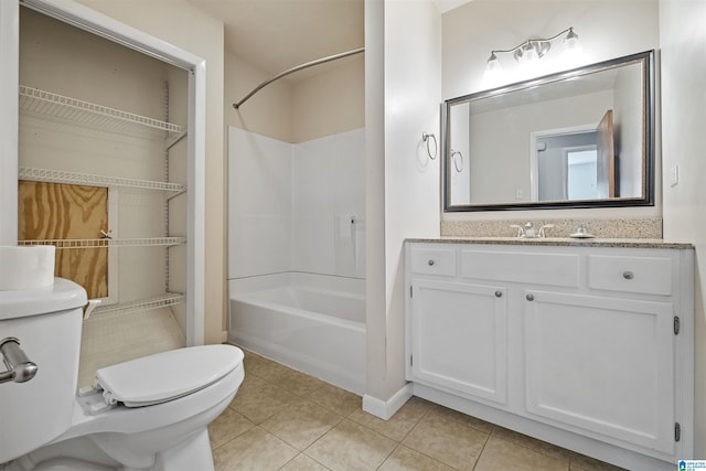 402 S 8th St, Gadsden, AL 35901 - full bath featuring toilet, tile patterned flooring,  shower combination, vanity, and baseboards