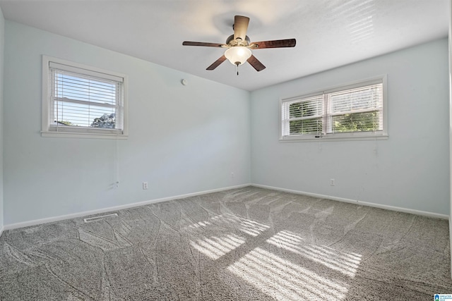 402 S 8th St, Gadsden, AL 35901 - empty room with healthy amount of natural light, carpet, baseboards, and ceiling fan