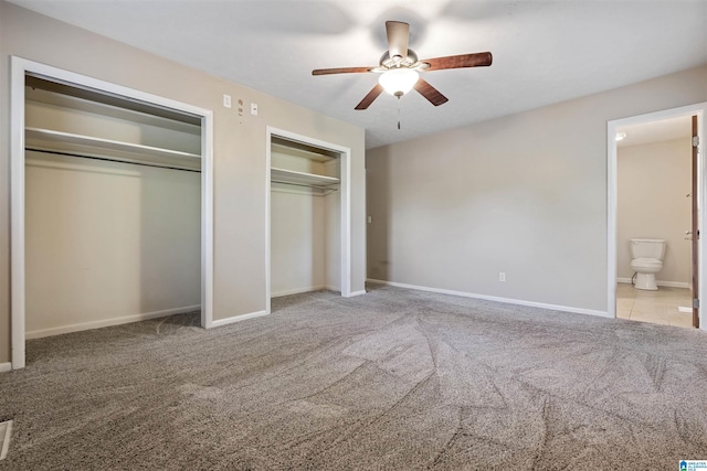 402 S 8th St, Gadsden, AL 35901 - unfurnished bedroom with multiple closets, carpet, baseboards, and connected bathroom