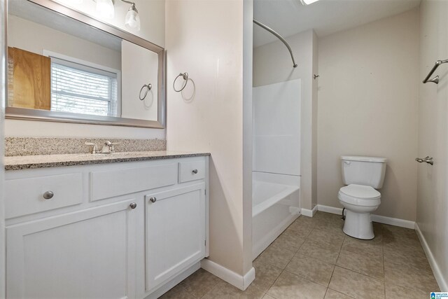 402 S 8th St, Gadsden, AL 35901 - bathroom featuring toilet, tile patterned floors,  shower combination, baseboards, and vanity