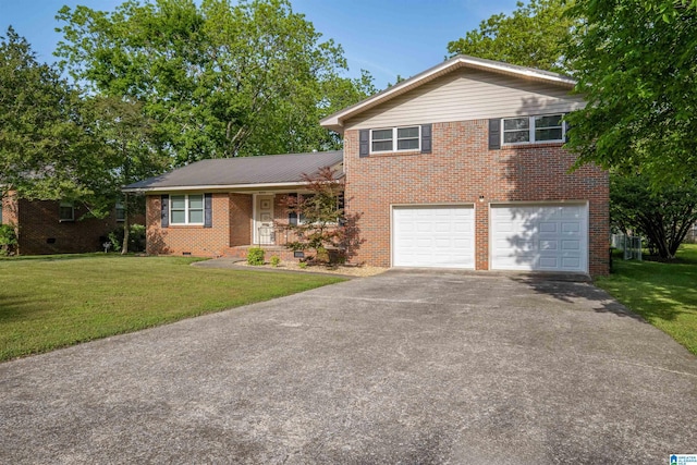 402 S 8th St, Gadsden, AL 35901 - view of front of property with asphalt driveway, brick siding, a front yard, and a garage