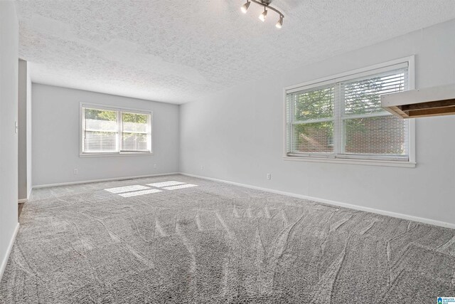 402 S 8th St, Gadsden, AL 35901 - carpeted spare room with a textured ceiling and baseboards