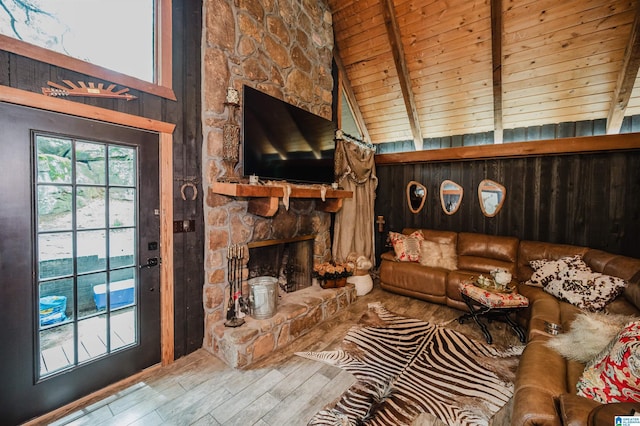 4410 S Shades Crest Rd, Helena, AL 35022 - living area featuring wood finished floors, beam ceiling, wood ceiling, a stone fireplace, and wooden walls