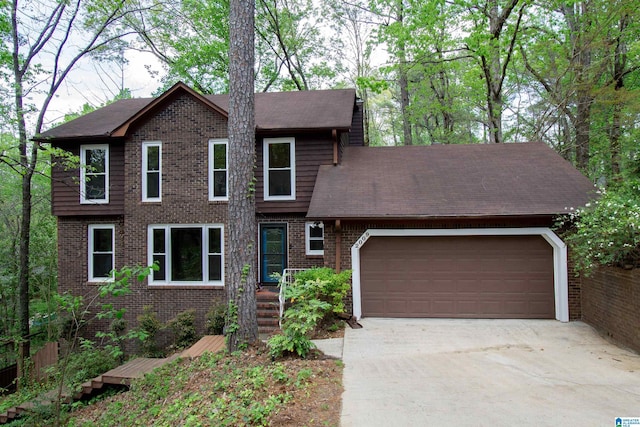 2009 Crossvine Rd, Hoover, AL 35244 - view of front of property with an attached garage, concrete driveway, brick siding, and roof with shingles