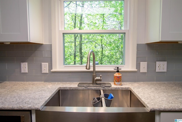 2009 Crossvine Rd, Hoover, AL 35244 - kitchen with a sink, white cabinets, and decorative backsplash