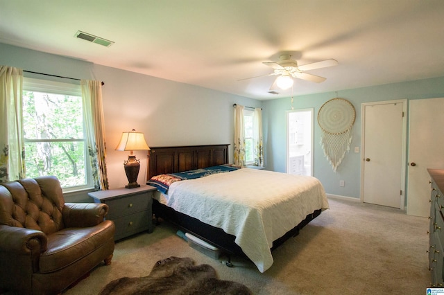 2009 Crossvine Rd, Hoover, AL 35244 - bedroom with multiple windows, light carpet, and a ceiling fan